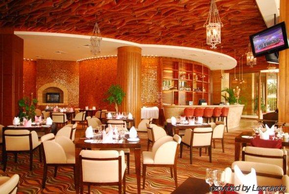 Grand Soluxe Hotel & Resort, سانيا المطعم الصورة